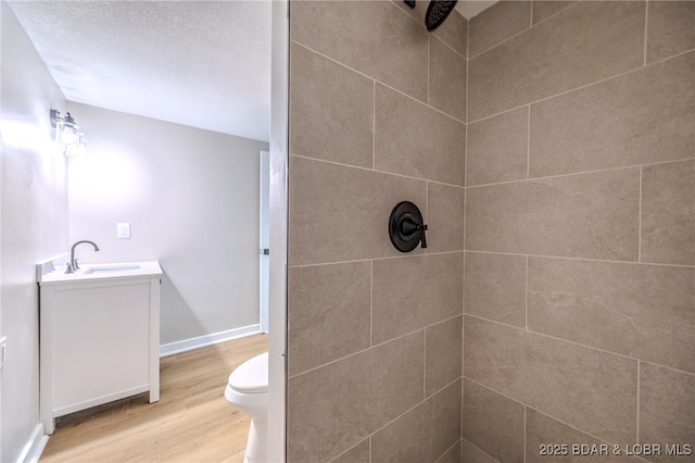 29 Vine St, Edwards, MO 65326 - full bath with wood finished floors, tiled shower, and vanity