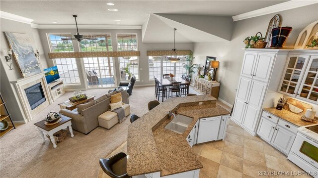 15 Pointe Ct, Lake Ozark, MO 65049 - kitchen featuring white appliances, ornamental molding, a sink, white cabinets, and ceiling fan