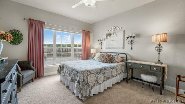 15 Pointe Ct, Lake Ozark, MO 65049 - bedroom with light colored carpet, a ceiling fan, and baseboards