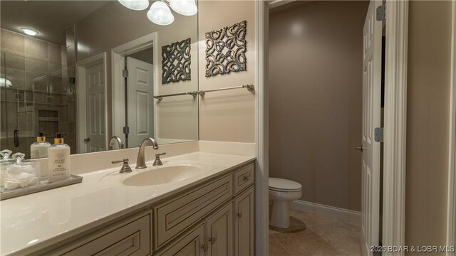 15 Pointe Ct, Lake Ozark, MO 65049 - bathroom with toilet, vanity, tile patterned flooring, tiled shower, and baseboards