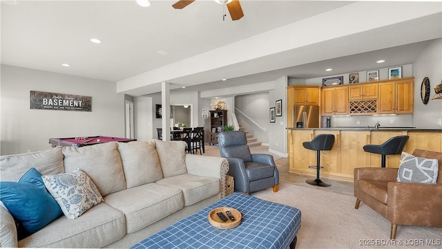 15 Pointe Ct, Lake Ozark, MO 65049 - living area with wet bar, light colored carpet, stairway, recessed lighting, and a ceiling fan