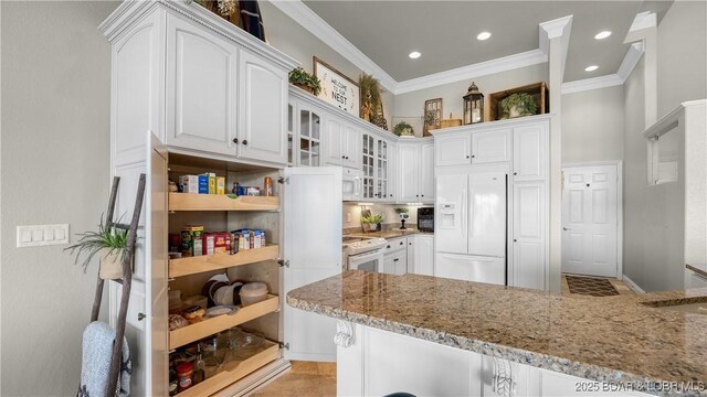15 Pointe Ct, Lake Ozark, MO 65049 - kitchen featuring white appliances, light stone countertops, white cabinets, crown molding, and recessed lighting