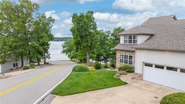 15 Pointe Ct, Lake Ozark, MO 65049 - view of asphalt road featuring a water view