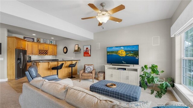 15 Pointe Ct, Lake Ozark, MO 65049 - living room featuring bar with sink, light colored carpet, baseboards, a ceiling fan, and recessed lighting