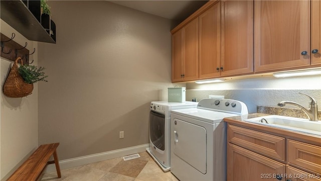 15 Pointe Ct, Lake Ozark, MO 65049 - laundry room with cabinet space, washing machine and clothes dryer, and baseboards