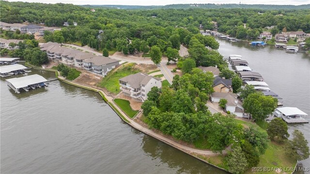 15 Pointe Ct, Lake Ozark, MO 65049 - aerial view of residential area featuring a nearby body of water and a heavily wooded area