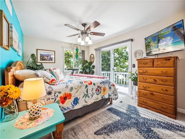 590 Jupiter Rd, Camdenton, MO 65020 - carpeted bedroom featuring access to outside and a ceiling fan