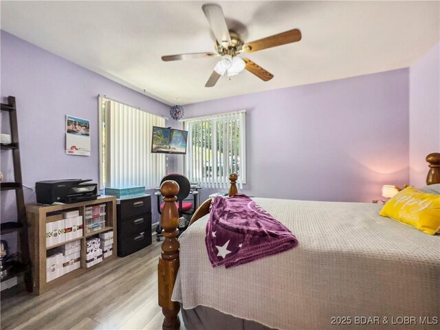 590 Jupiter Rd, Camdenton, MO 65020 - bedroom featuring wood finished floors and a ceiling fan