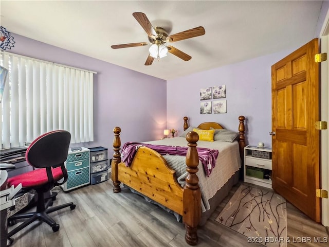 590 Jupiter Rd, Camdenton, MO 65020 - bedroom with wood finished floors and a ceiling fan