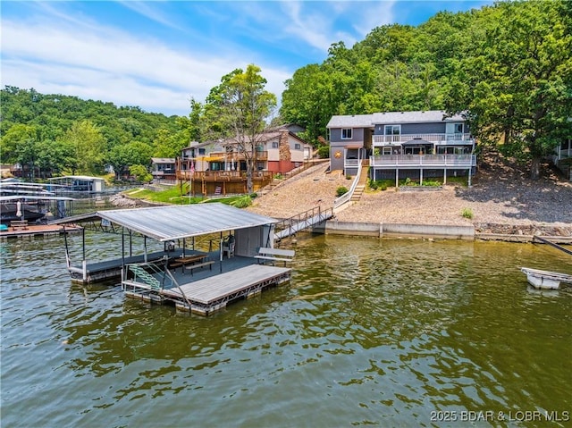 590 Jupiter Rd, Camdenton, MO 65020 - dock area featuring boat lift, a deck with water view, and stairway