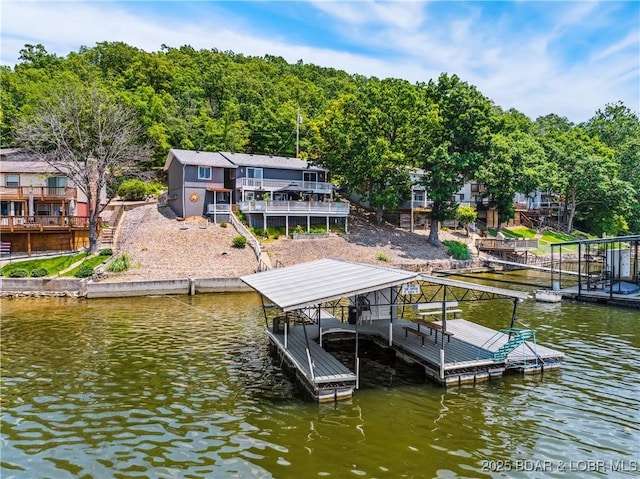590 Jupiter Rd, Camdenton, MO 65020 - dock with boat lift, stairway, and a deck with water view