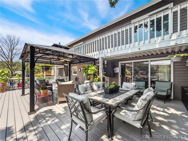 590 Jupiter Rd, Camdenton, MO 65020 - wooden deck featuring a gazebo, an outdoor living space, and outdoor dining space