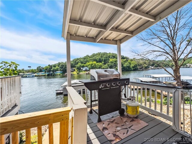 590 Jupiter Rd, Camdenton, MO 65020 - wooden deck with a water view, grilling area, and a dock