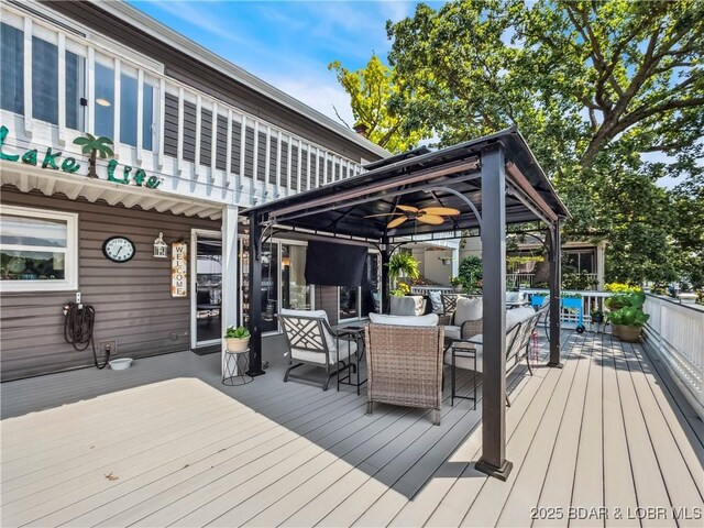 590 Jupiter Rd, Camdenton, MO 65020 - wooden deck with a gazebo and outdoor dining space