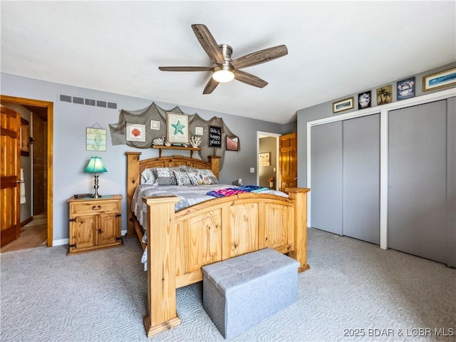 590 Jupiter Rd, Camdenton, MO 65020 - bedroom with two closets, light carpet, and ceiling fan