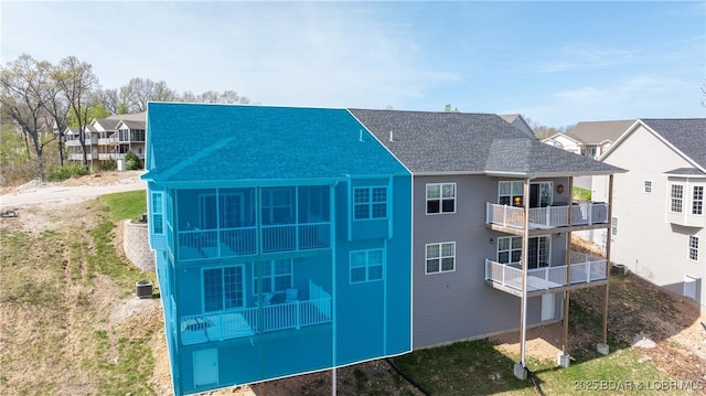 23 Enclaves Ln, Lake Ozark, MO 65049 - back of house with roof with shingles and a residential view