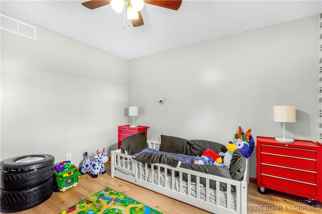 180 Skylark Ln, Linn Creek, MO 65052 - bedroom with wood finished floors and ceiling fan
