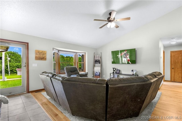 180 Skylark Ln, Linn Creek, MO 65052 - living room with lofted ceiling, a ceiling fan, and light wood-style flooring