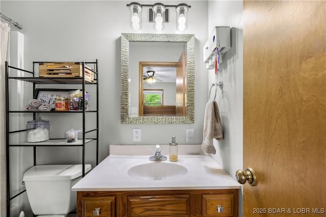 180 Skylark Ln, Linn Creek, MO 65052 - bathroom featuring toilet, vanity, and a ceiling fan