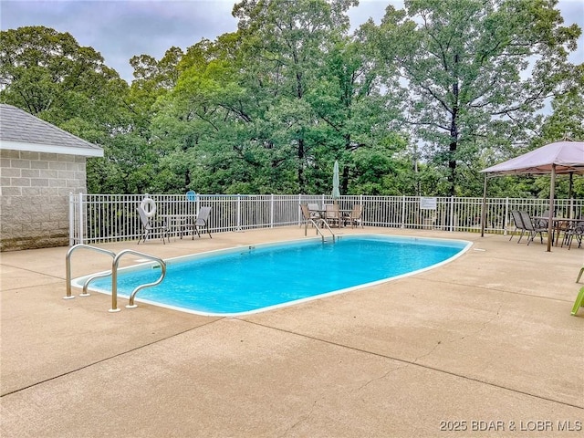 72 Quiet Meadows Dr, Linn Creek, MO 65052 - community pool with a patio area and view of scattered trees