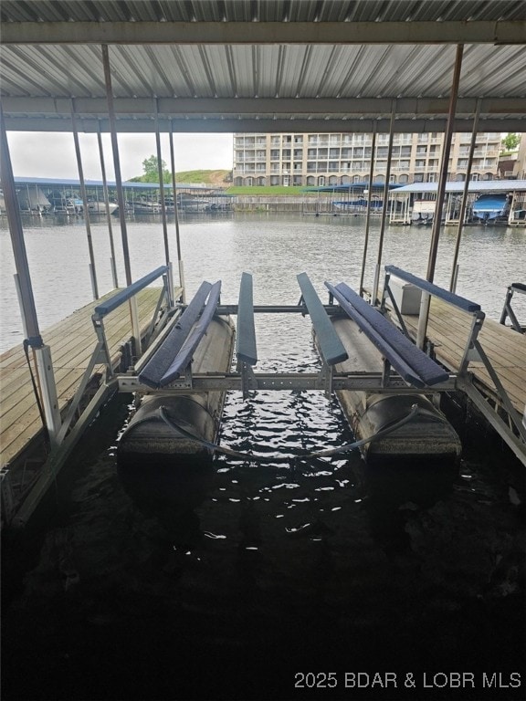 4897 Bridgepointe Dr Unit 141, Osage Beach, MO 65065 - dock area featuring boat lift and a water view