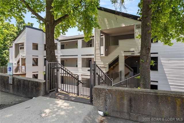 4897 Bridgepointe Dr Unit 141, Osage Beach, MO 65065 - view of building exterior featuring stairs