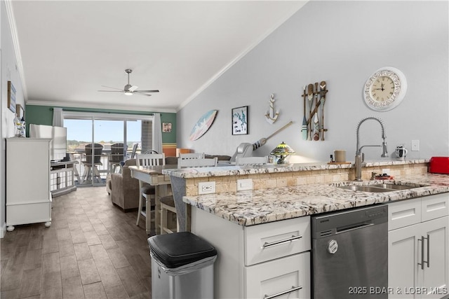 4897 Bridgepointe Dr Unit 141, Osage Beach, MO 65065 - kitchen featuring dishwasher, a sink, ornamental molding, a ceiling fan, and white cabinets