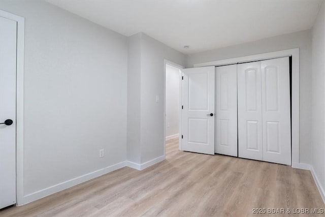 13 Leisure Rd, Eldon, MO 65026 - unfurnished bedroom with light wood-type flooring and a closet