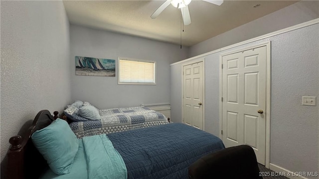 18997 Mystical Ln, Versailles, MO 65084 - bedroom featuring a textured wall and a ceiling fan