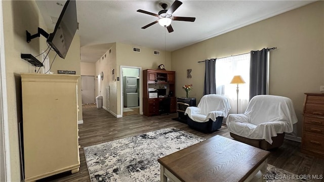 18997 Mystical Ln, Versailles, MO 65084 - living area with a ceiling fan and dark wood-style floors