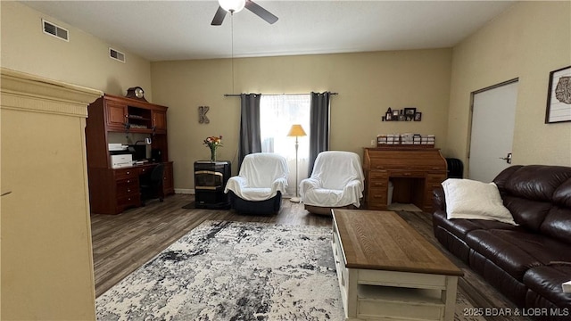 18997 Mystical Ln, Versailles, MO 65084 - living area featuring ceiling fan and dark wood-style floors