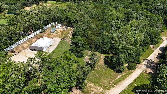 18997 Mystical Ln, Versailles, MO 65084 - aerial view of property and surrounding area featuring a heavily wooded area