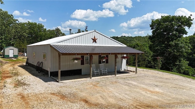 18997 Mystical Ln, Versailles, MO 65084 - view of front of property with a storage unit and a metal roof