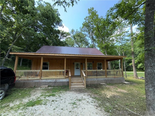 58 Aztec Ln, Eldon, MO 65026 - view of front of property featuring a porch, a metal roof, and board and batten siding