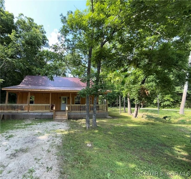 58 Aztec Ln, Eldon, MO 65026 - view of front of house with a porch, a metal roof, and a front lawn