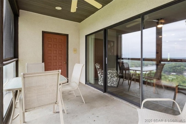 33 Monterey Dr Unit 2A, Lake Ozark, MO 65049 - sunroom featuring outdoor dining space, concrete floors, and a ceiling fan