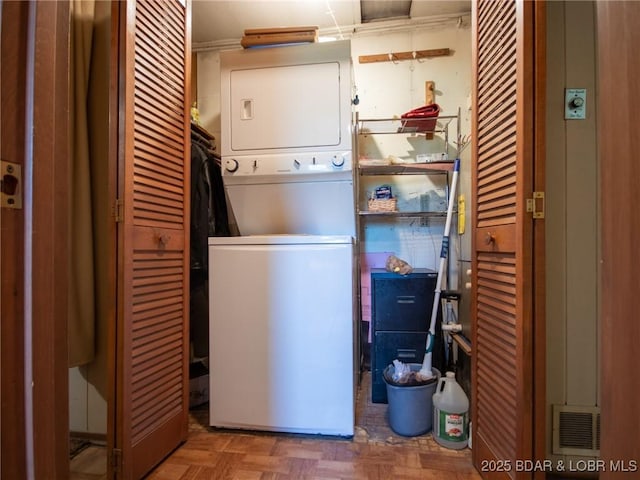 32056 Gentry Ln, Gravois Mills, MO 65037 - washroom with stacked washing machine and dryer