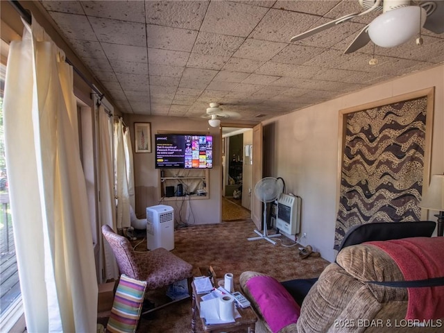 32056 Gentry Ln, Gravois Mills, MO 65037 - living area featuring ceiling fan, heating unit, and carpet floors