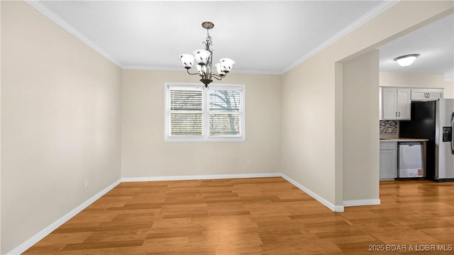 462 Lakeview Dr, Camdenton, MO 65020 - unfurnished dining area with a chandelier, light wood finished floors, and ornamental molding