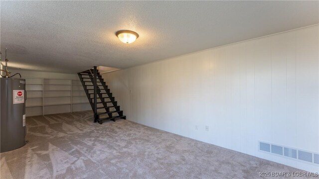 462 Lakeview Dr, Camdenton, MO 65020 - basement with electric water heater, carpet, a textured ceiling, and stairway