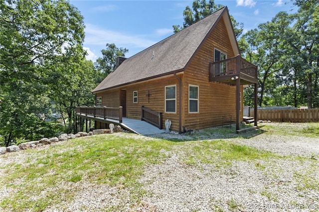 28 Hamilton Way, Sunrise Beach, MO 65079 - view of home's exterior with a shingled roof, a deck, and a balcony