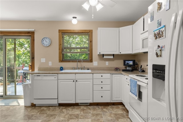 28 Hamilton Way, Sunrise Beach, MO 65079 - kitchen with white appliances, light countertops, white cabinets, and ceiling fan
