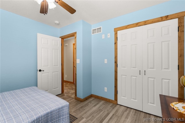 28 Hamilton Way, Sunrise Beach, MO 65079 - bedroom with light wood finished floors, a closet, and a ceiling fan