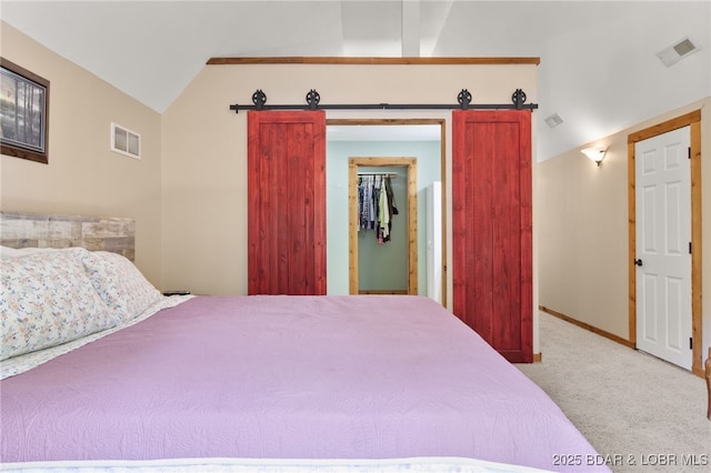 28 Hamilton Way, Sunrise Beach, MO 65079 - bedroom with carpet, a walk in closet, vaulted ceiling, and a closet