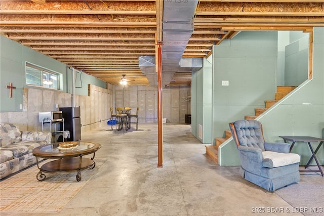 28 Hamilton Way, Sunrise Beach, MO 65079 - basement featuring stairway and freestanding refrigerator