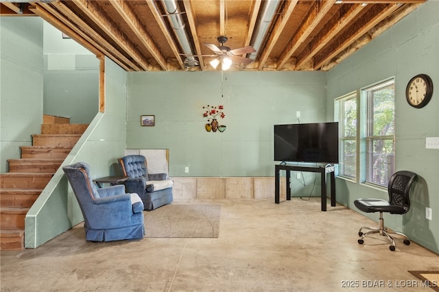 28 Hamilton Way, Sunrise Beach, MO 65079 - living room with unfinished concrete flooring, ceiling fan, and stairs