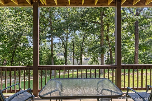 28 Hamilton Way, Sunrise Beach, MO 65079 - wooden deck featuring outdoor dining area, view of scattered trees, and a water view
