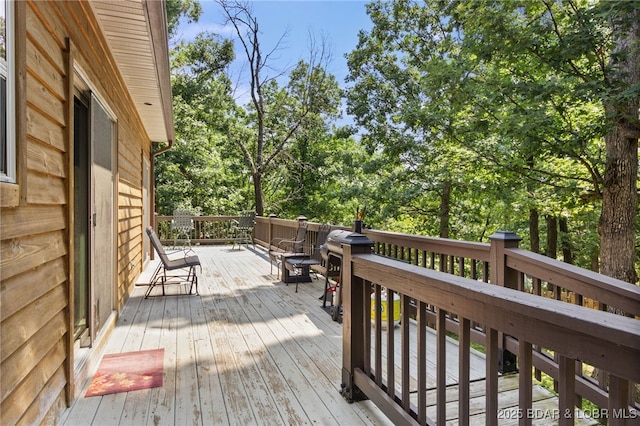 28 Hamilton Way, Sunrise Beach, MO 65079 - wooden terrace with view of scattered trees