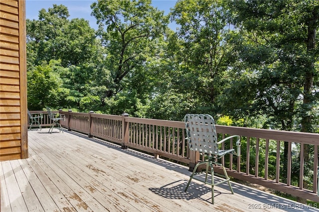 28 Hamilton Way, Sunrise Beach, MO 65079 - wooden terrace featuring view of wooded area