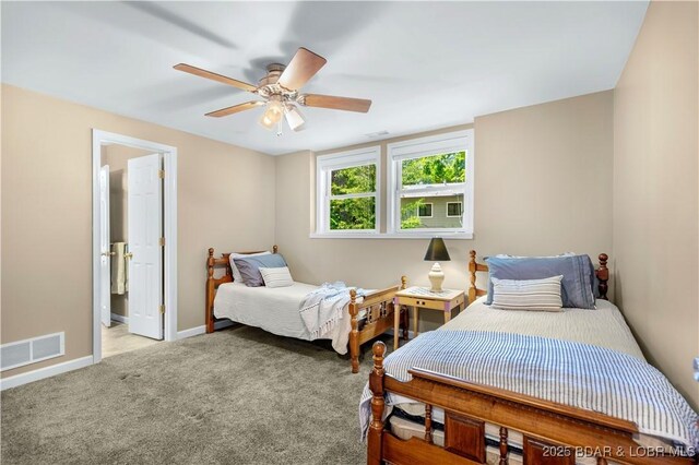 164 Get A Way Ln, Camdenton, MO 65020 - bedroom with carpet flooring, a ceiling fan, and ensuite bath
